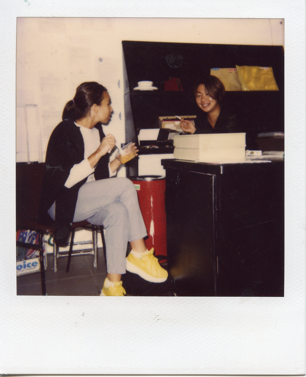 Joanne and Yoko having lunch at the front desk, Parsons Paris. 