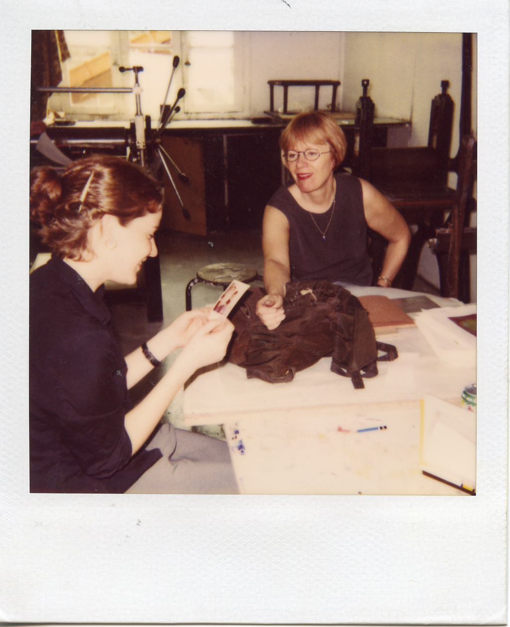 Hanna and Margaret looking at one of my polaroids, Printmaking studio, Parsons Paris.